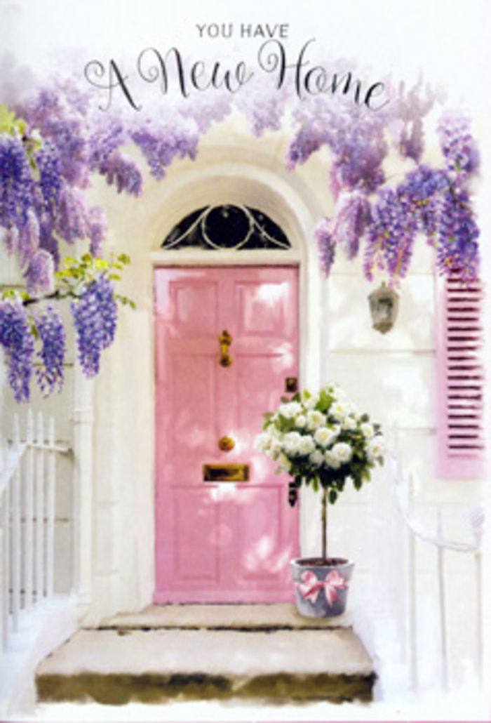 The scene feels like a peaceful corner of Richmond upon Thames on a bright yet gentle day, perhaps along a residential street not far from the bustle of George Street. At the centre stands a solid wooden door, painted in a soft, chalky pink that glows in the natural light, suggesting warmth, hospitality, and the anticipation of new stories just inside. The surrounding wall is whitewashed and smooth, creating a clean canvas that allows the colours of the flowers and paintwork to sing without distraction. Above the entrance, wisteria cascades in luxuriant clusters, its long drooping blooms a mix of lavender, lilac, and faintly silvery purple. The flowers hang like delicate curtains, each blossom formed of tiny petals that, together, seem almost luminous. You can imagine the scent: sweet, lightly honeyed, carried by the same breeze that drifts up from the Thames. On the doorstep, a grey tin bucket has been thoughtfully placed, as if a friend or neighbour has just dropped off a housewarming arrangement. Inside the bucket, white and cream roses are packed generously, some blooms fully open and ruffled, others just beginning to unfurl their petals. Their surfaces appear velvety and plush, inviting the touch. Wisps of soft green foliage spill out among the roses, creating an organic, slightly relaxed silhouette that balances the elegance of the flowers. A satin ribbon, pale pink and subtly lustrous, embraces the base of the bucket, tying the composition back to the colour of the door with quiet harmony. Dappled sunlight filters through the layers of wisteria leaves overhead, sketching light patterns onto stone and wood, and imbuing the whole doorway with expectation. It is an image that speaks clearly of a new chapter-a new home in Richmond-marked with gentle celebration, warmth, and the unspoken promise that flowers can make arrival feel like belonging.
